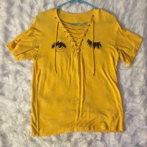 Yellow graphic lace up T-shirt.